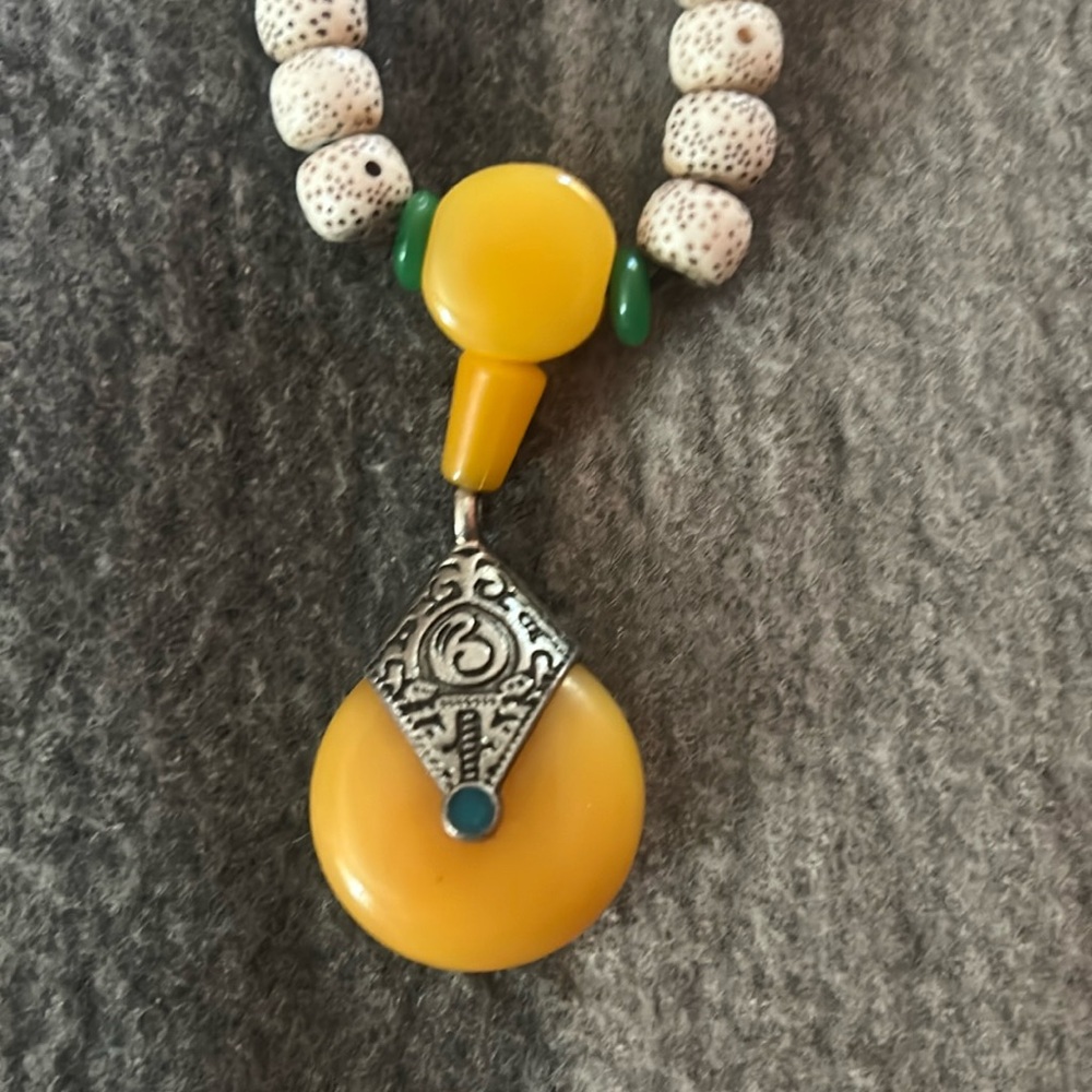 Tibetan necklace blue stone on one side red on other side measuring 18 inche